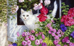 Белая кошка в цветах