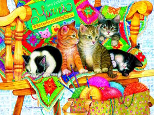 Котята на кресле