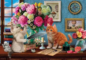 Котята и письменный стол